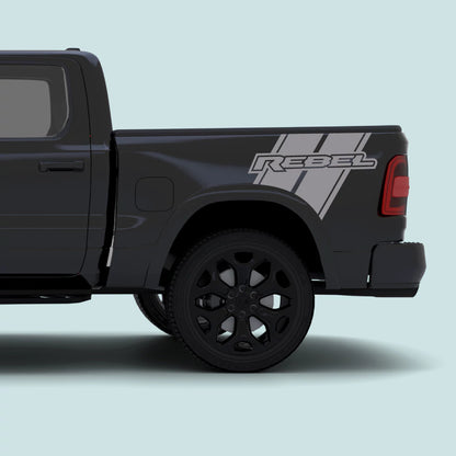 2019–present Ram 1500 with grey Rebel side bed stripe decal kit and REBEL text vinyl graphics
